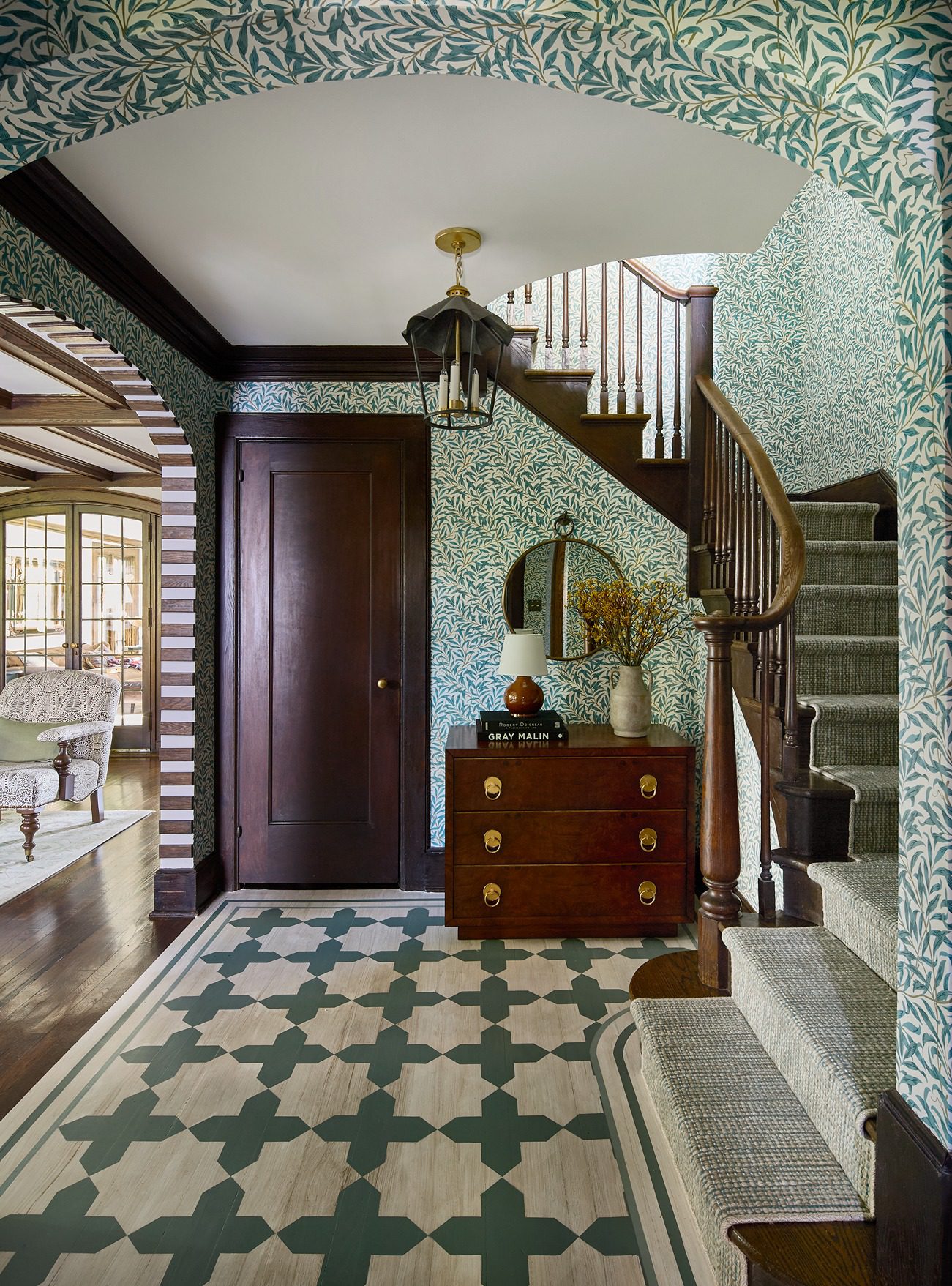 teal tudor foyer, northern new jersey historic home, dark wood accepts, vibrant plaful wallpaper and painted floor. pattern rich design solutions