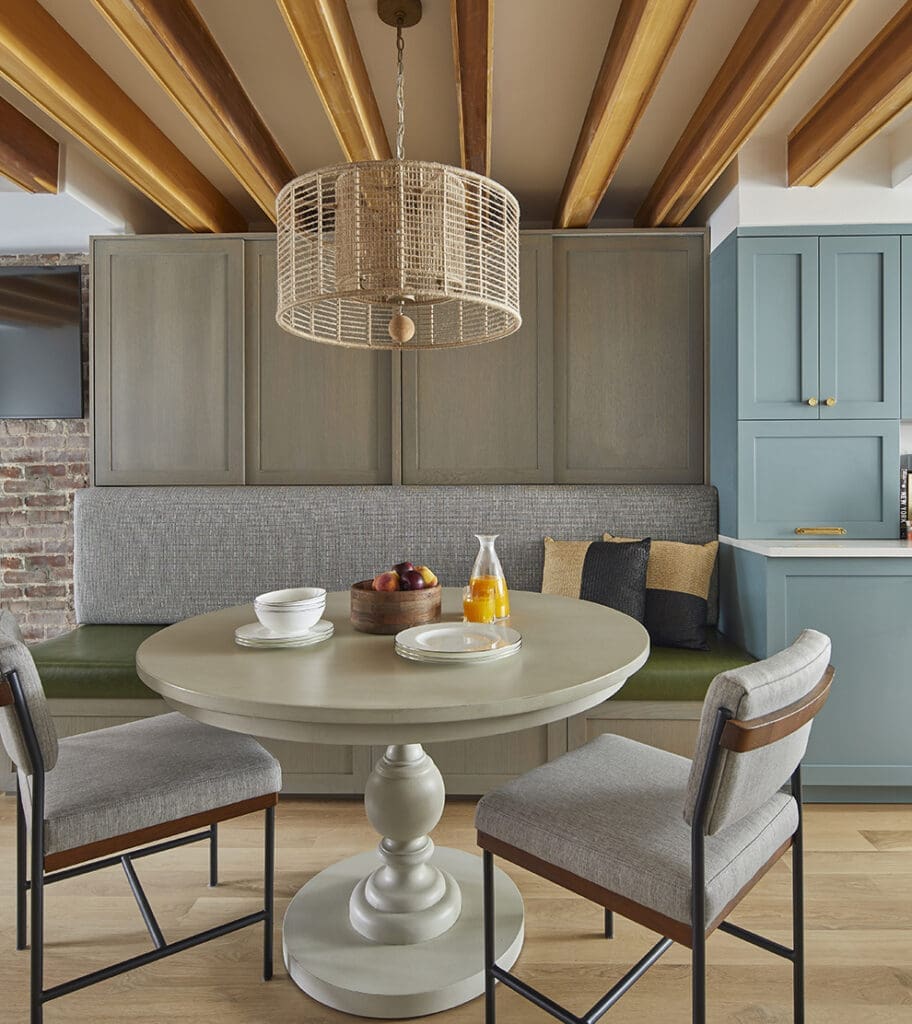 jersey city new jersey luxury dining experience with grey and green built-in banquette and integrated storage. space planning expertise and smart home design solutions.