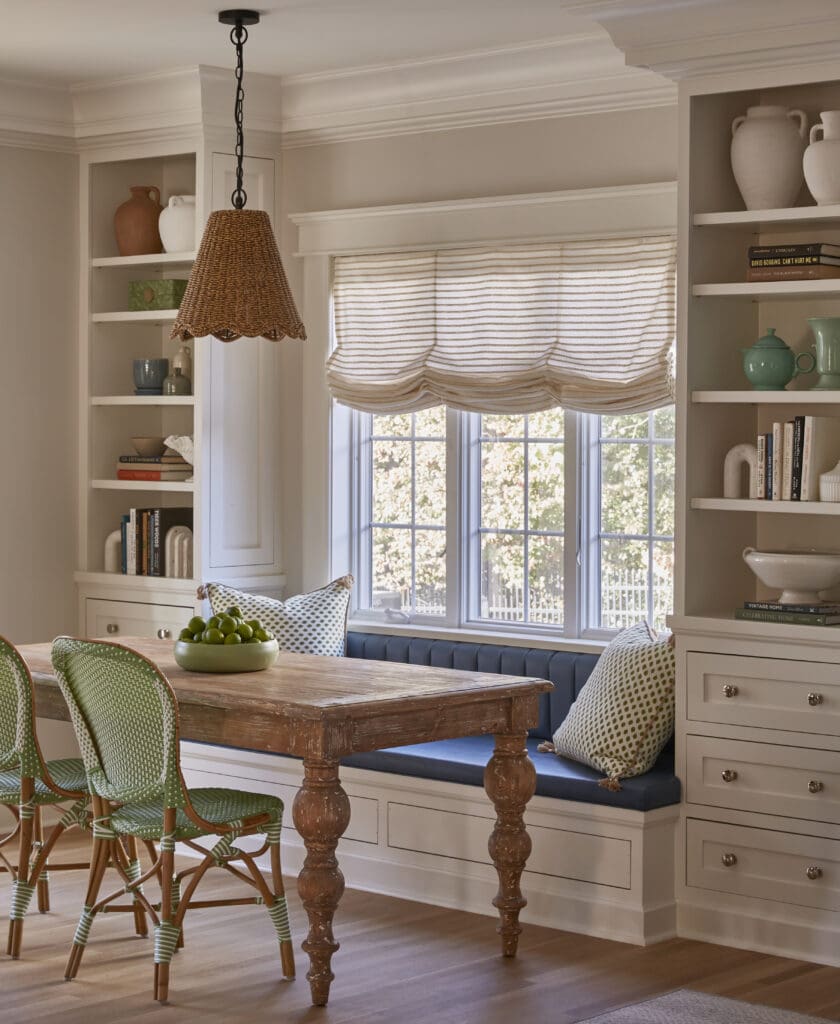 tri-state area cozy transitional kitchen dining room with custom built-in blue leather banquette with vertical channeling. family friendly luxury interior design inspiration.