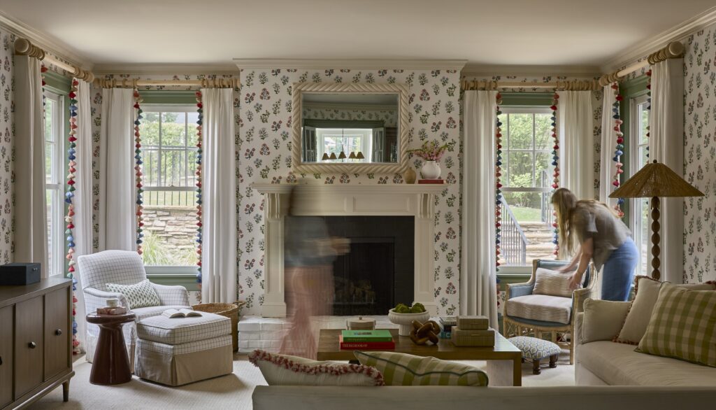Morris county traditional colonial family room with floral wallpaper and pops of color. historic home renovation.