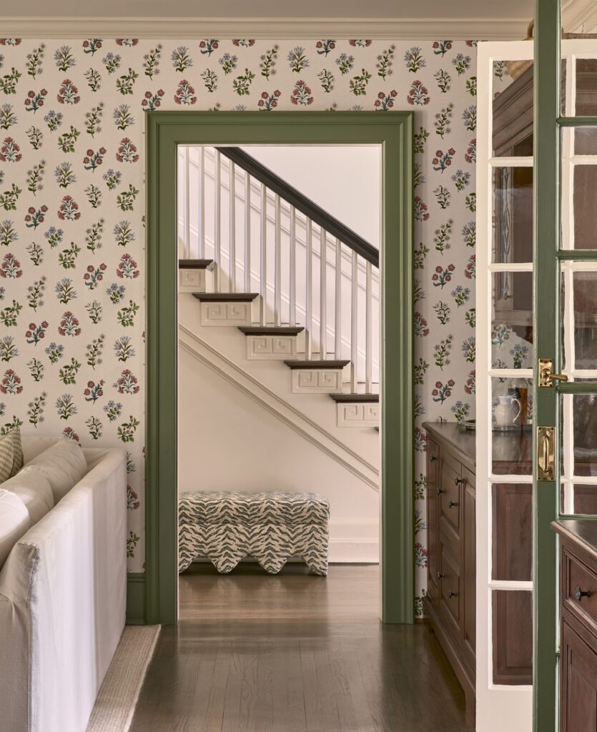 Morris county traditional colonial home. colorful painted green trim and floral wallpaper.